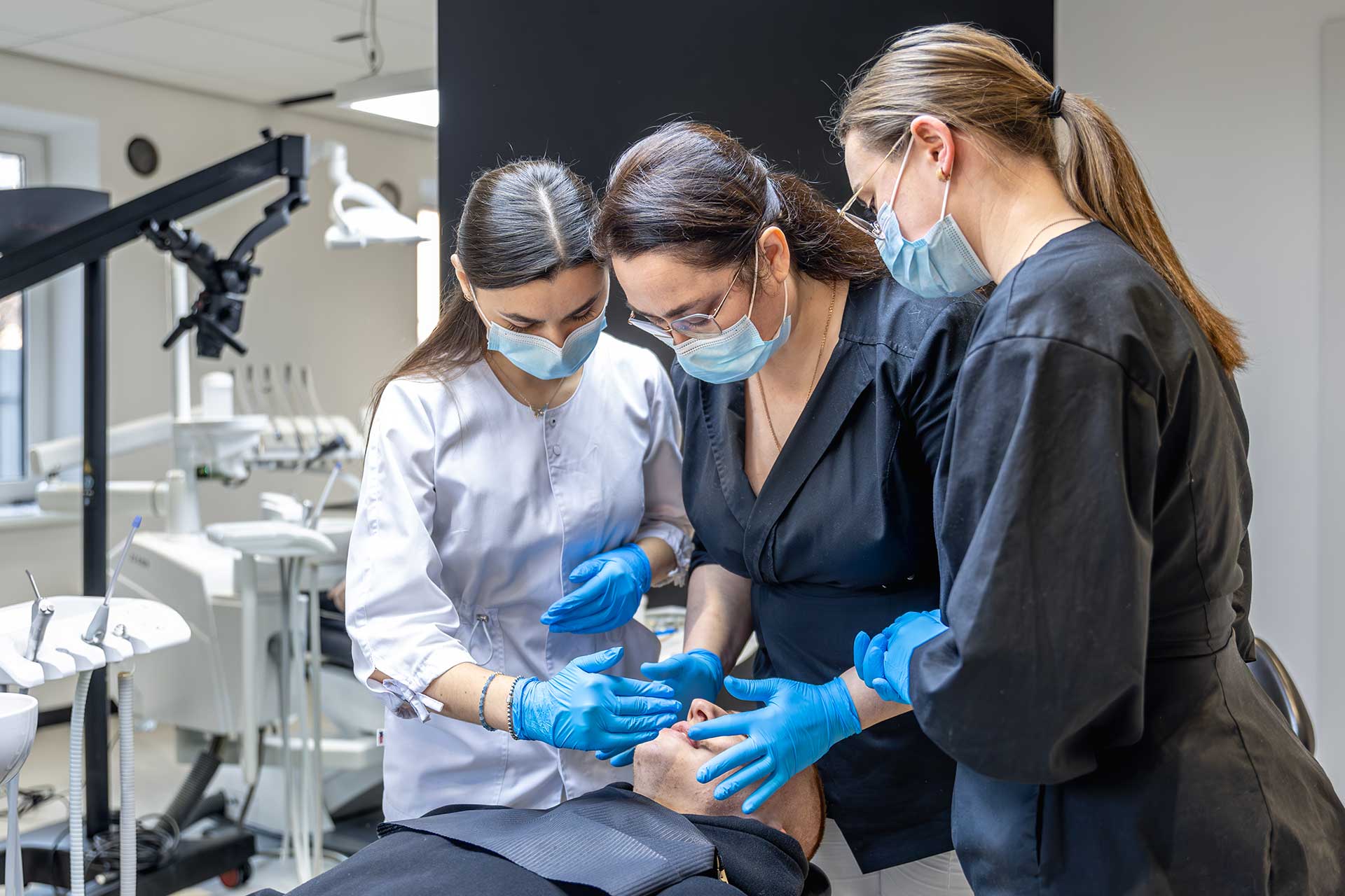 Dentique Dublin dental hygienists and clinical assistants working together in a modern dental clinic, providing professional and compassionate patient care