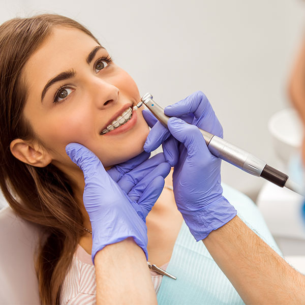 Patient receiving routine dental care at Dentique Dublin clinic, including check-ups, hygiene appointments, and preventive treatments
