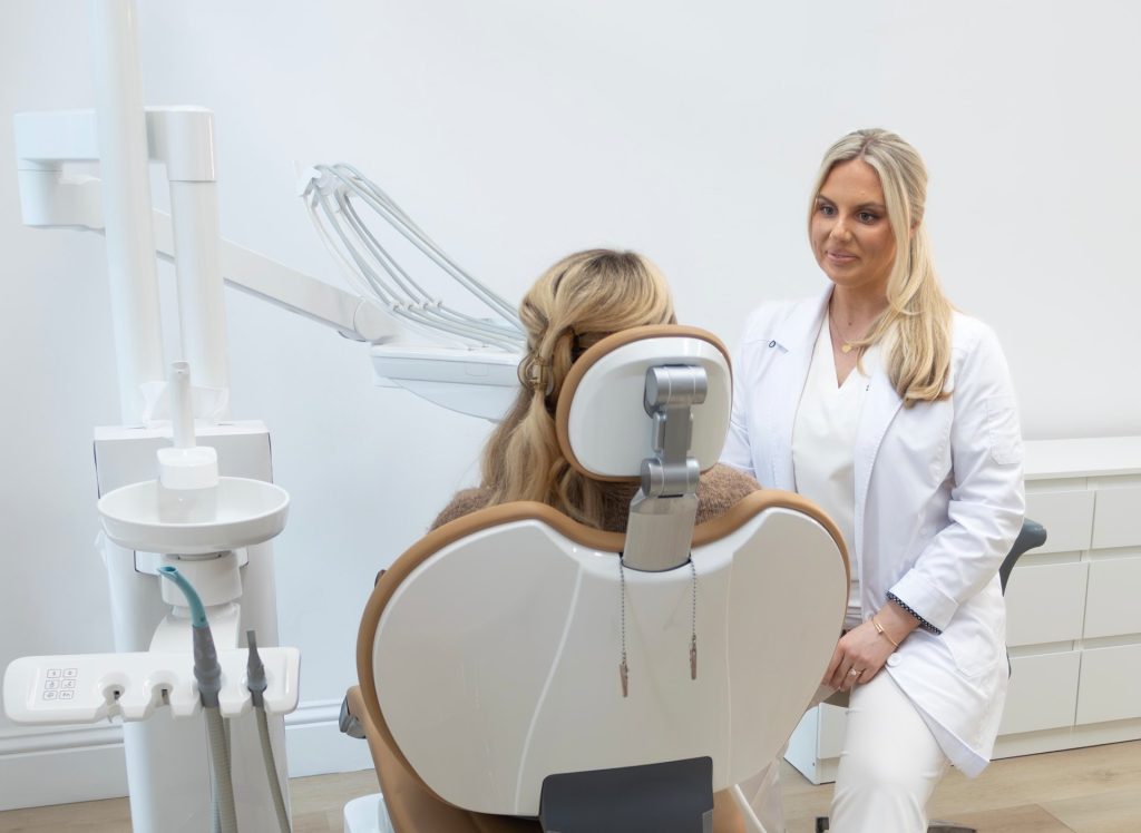 Dr Laura speaking with a patient at Dentique Dublin